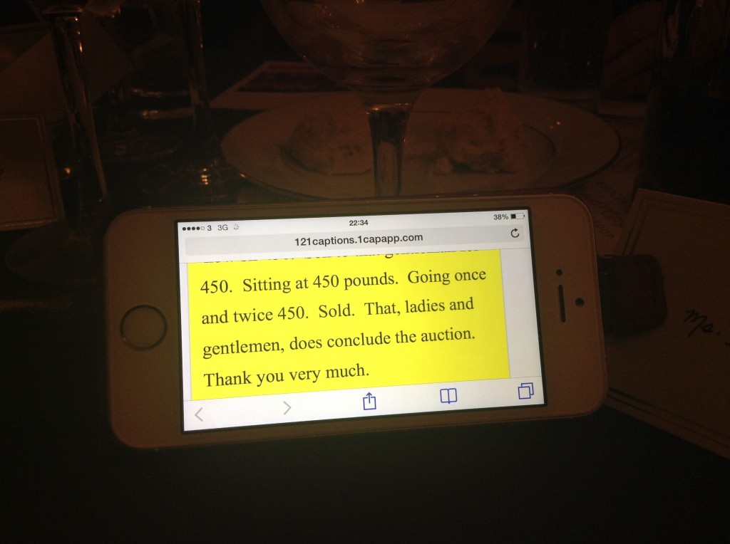 Online captions streamed to a mobile phone during the auction