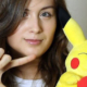 Photo of Rikki Poynter holding Pikachu