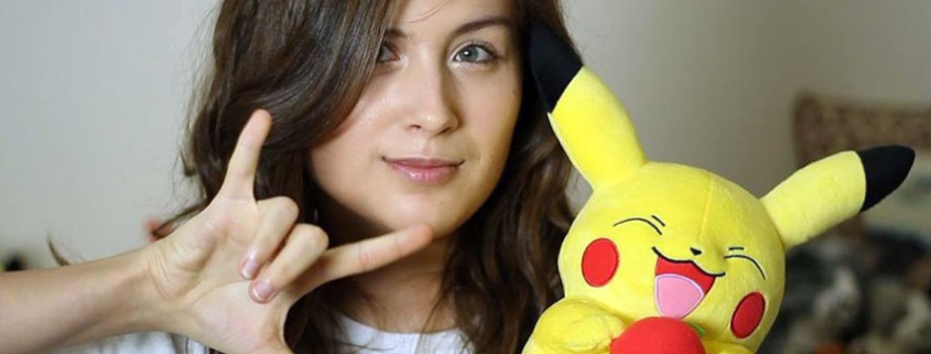 Photo of Rikki Poynter holding Pikachu