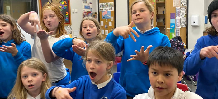 Children at Cheriton Fitzpaine School learning sign language