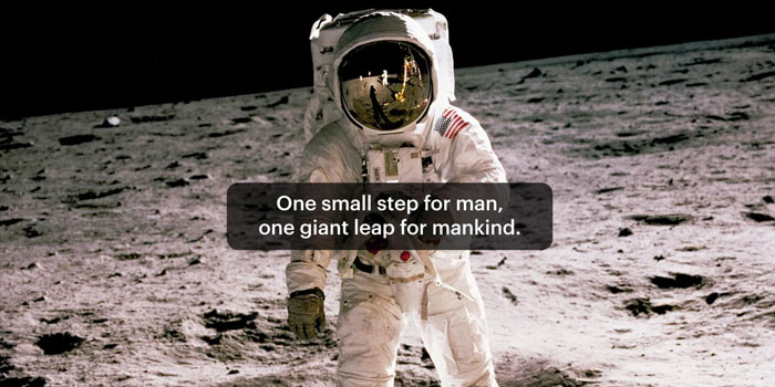 An astronaut in a spacesuit stands on the moon’s surface with Earth reflected in their visor; text overlay and Closed Captions read, “One small step for man, one giant leap for mankind.”.