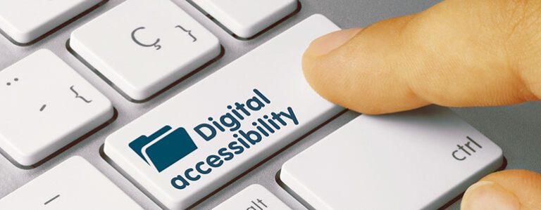 A finger presses a keyboard key labeled "Digital Accessibility," featuring an icon of a folder, highlighting the importance of accessible digital content.