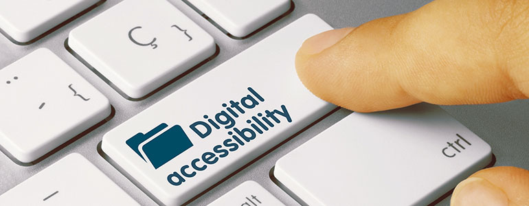 A finger presses a keyboard key labeled "Digital Accessibility," featuring an icon of a folder, highlighting the importance of accessible digital content.
