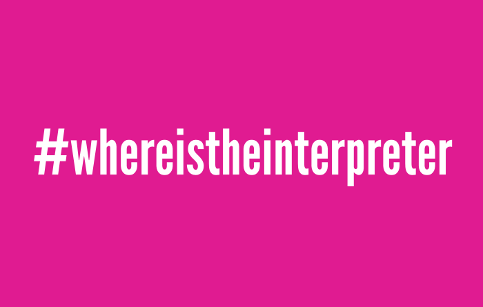 White text on a pink background boldly displays "#whereistheinterpreter" in a clean, sans-serif font, spotlighting the #whereistheinterpreter movement.