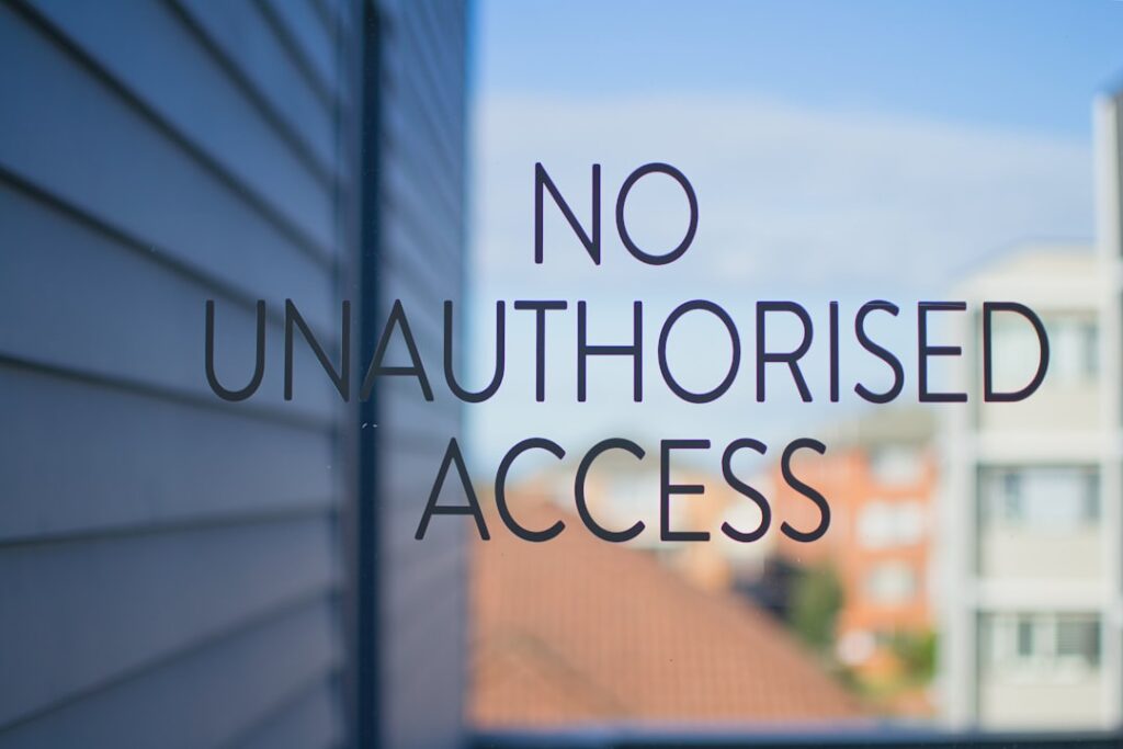 No unauthorised access sign on glass door.